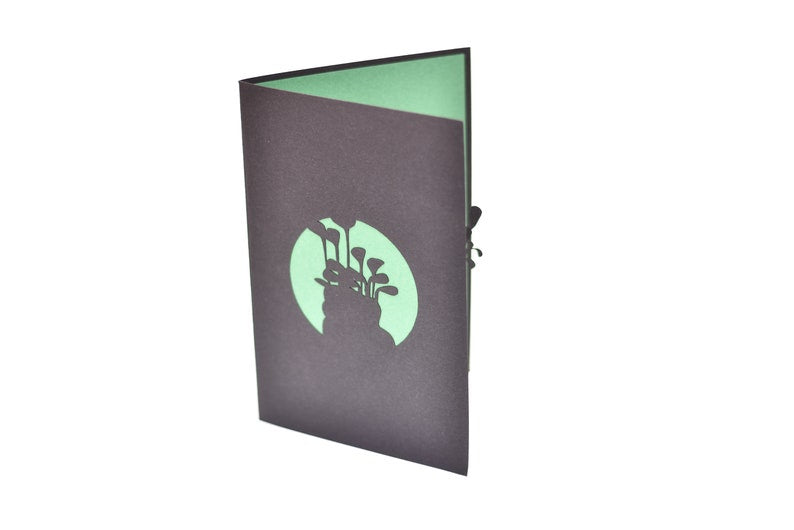 Golf 3D pop-up card by PopJoy Cards - detail of golf clubs against green background