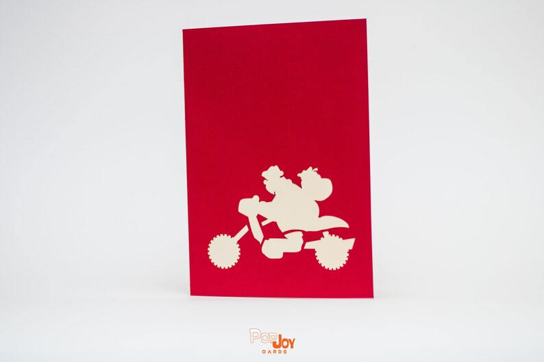 Motorcycle Santa 3D pop-up card by PopJoy Cards - detail of Santa and sack of toys