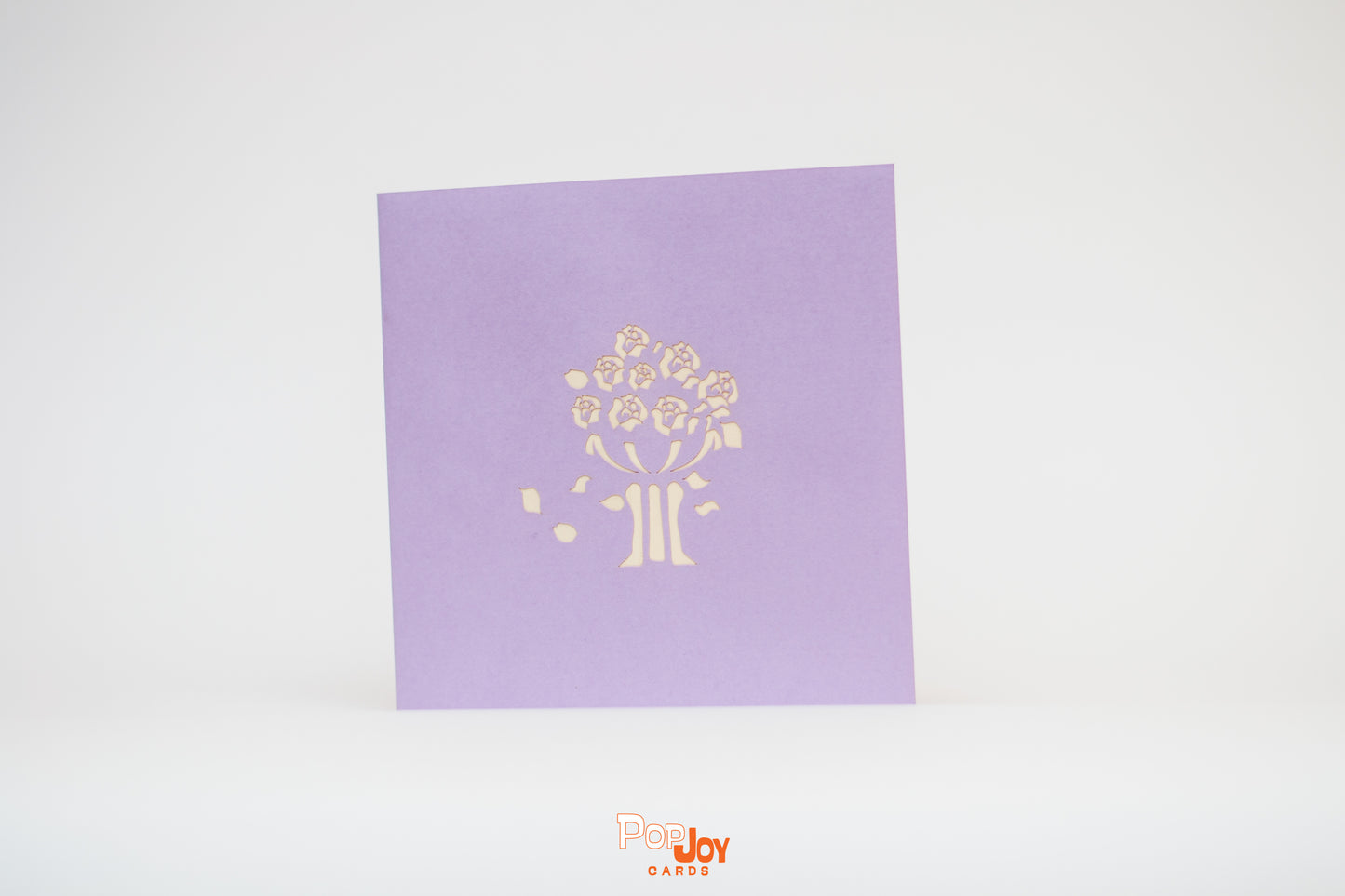 Purple card with flower jardinière etched into front cover