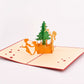 Christmas Tree Decorating 3D pop-up card by PopJoy Cards - open view, studio shot