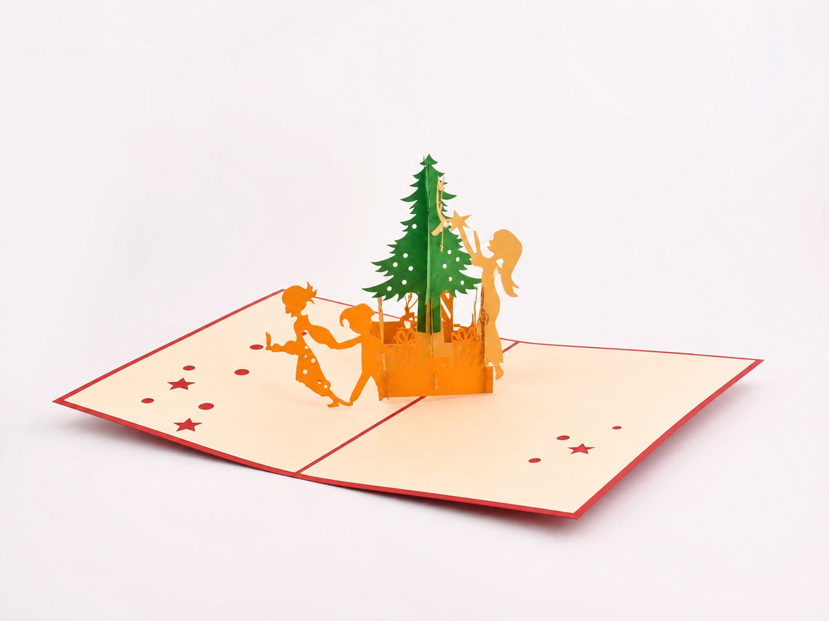Christmas Tree Decorating 3D pop-up card by PopJoy Cards - open view, studio shot