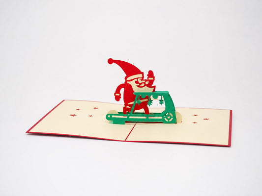 Exercising Santa 3D pop-up card by PopJoy Cards - open view, studio shot
