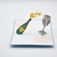 Champagne bottle and glasses pop-up card open