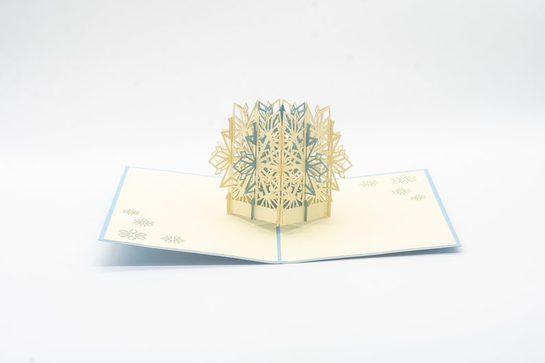 Snowflake 3D pop-up card by PopJoy Cards - open view with blue and white snowflake
