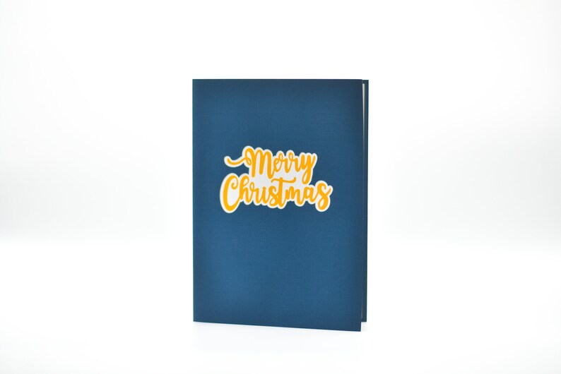 Merry Christmas pop-up card open with gold lettering