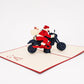 Motorcycle Santa 3D pop-up card by PopJoy Cards - open view, studio shot