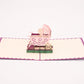 New Born Baby in Stroller 3D pop-up card by PopJoy Cards - open view, studio shot