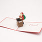 Santa Comes Down the Chimney 3D pop-up card by PopJoy Cards - open view, studio shot