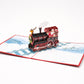 Santa on a Train 3D pop-up card by PopJoy Cards - open view, studio shot