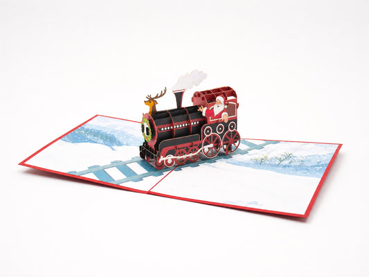 Santa on a Train 3D pop-up card by PopJoy Cards - open view, studio shot