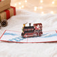 Santa on a Train 3D pop-up card by PopJoy Cards - lifestyle scene