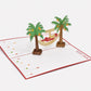 Santa on Vacation 3D pop-up card by PopJoy Cards - open view, studio shot