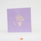 Purple card with flower jardinière etched into front cover 