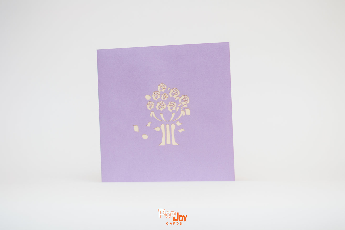 Purple card with flower jardinière etched into front cover 