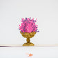 Pop-up card showing gold jardinière with pink and purple flowers 