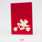 Red card with silhouette of Santa on his motorcycle in white