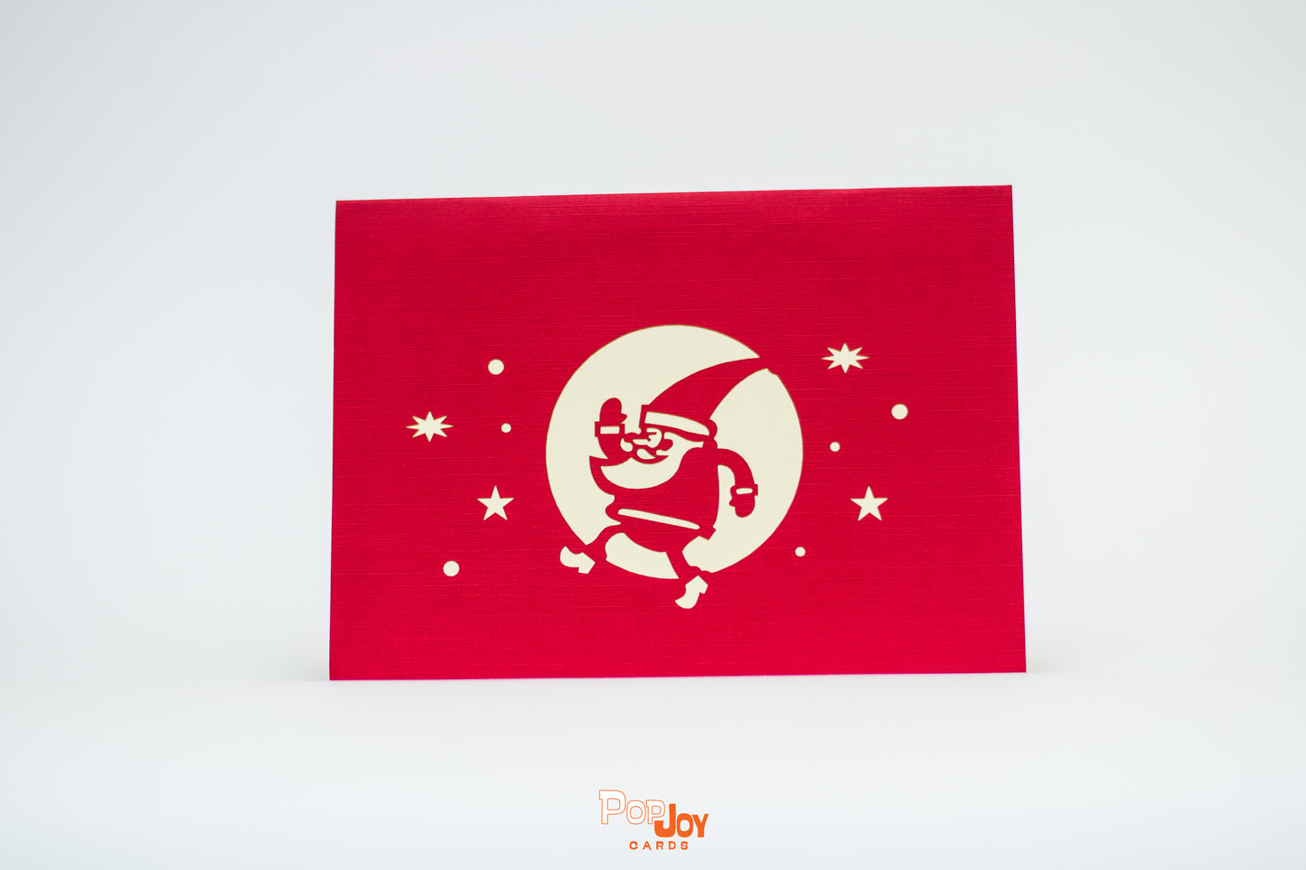 Red card showing Santa going for a jog in the night