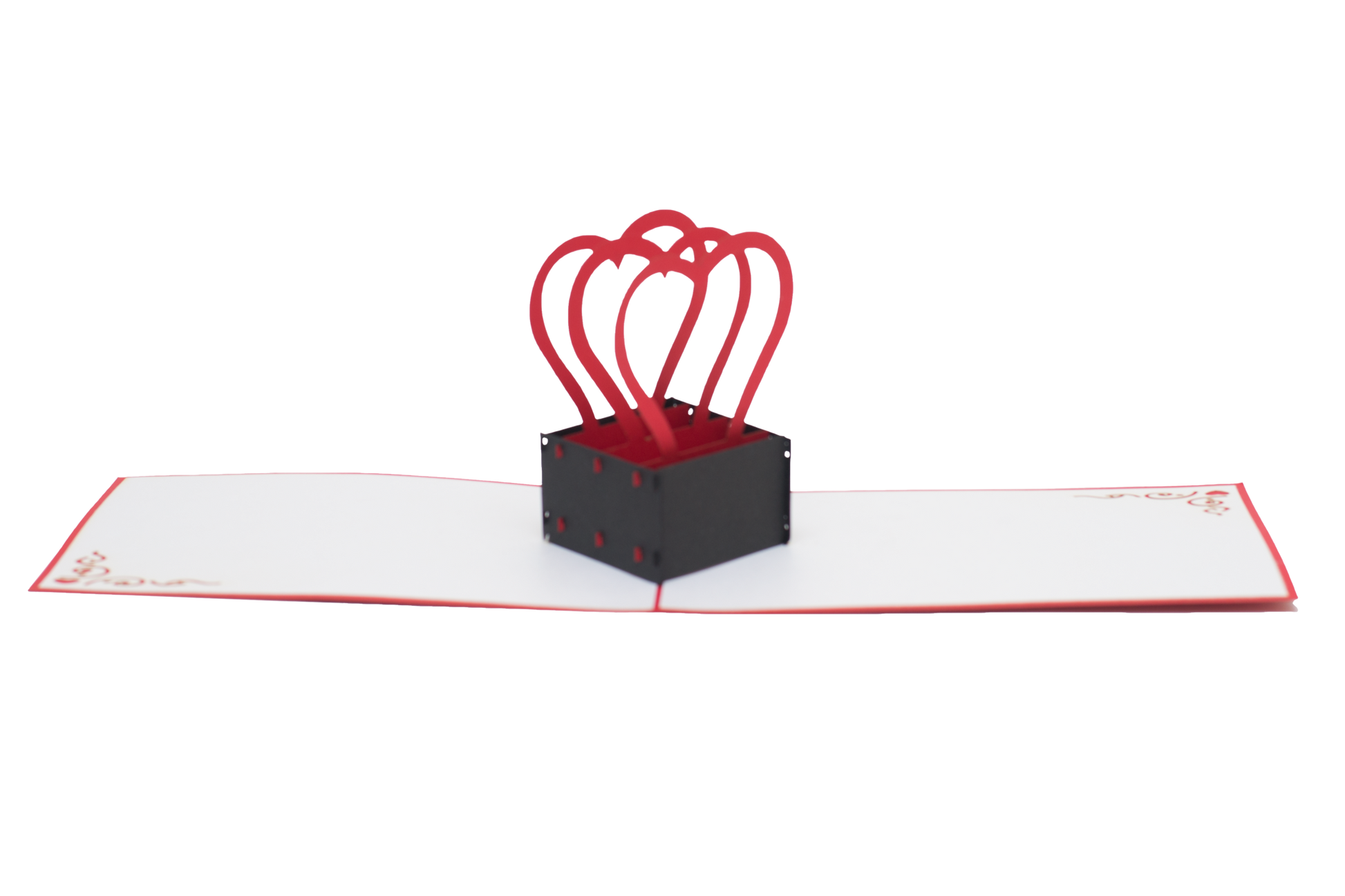 Pop-up card featuring three red heart-shaped arcs popping out of a black box in the middle