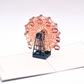 Pop-up card showing a detailed orange Ferris wheel with dark blue structure and red seats