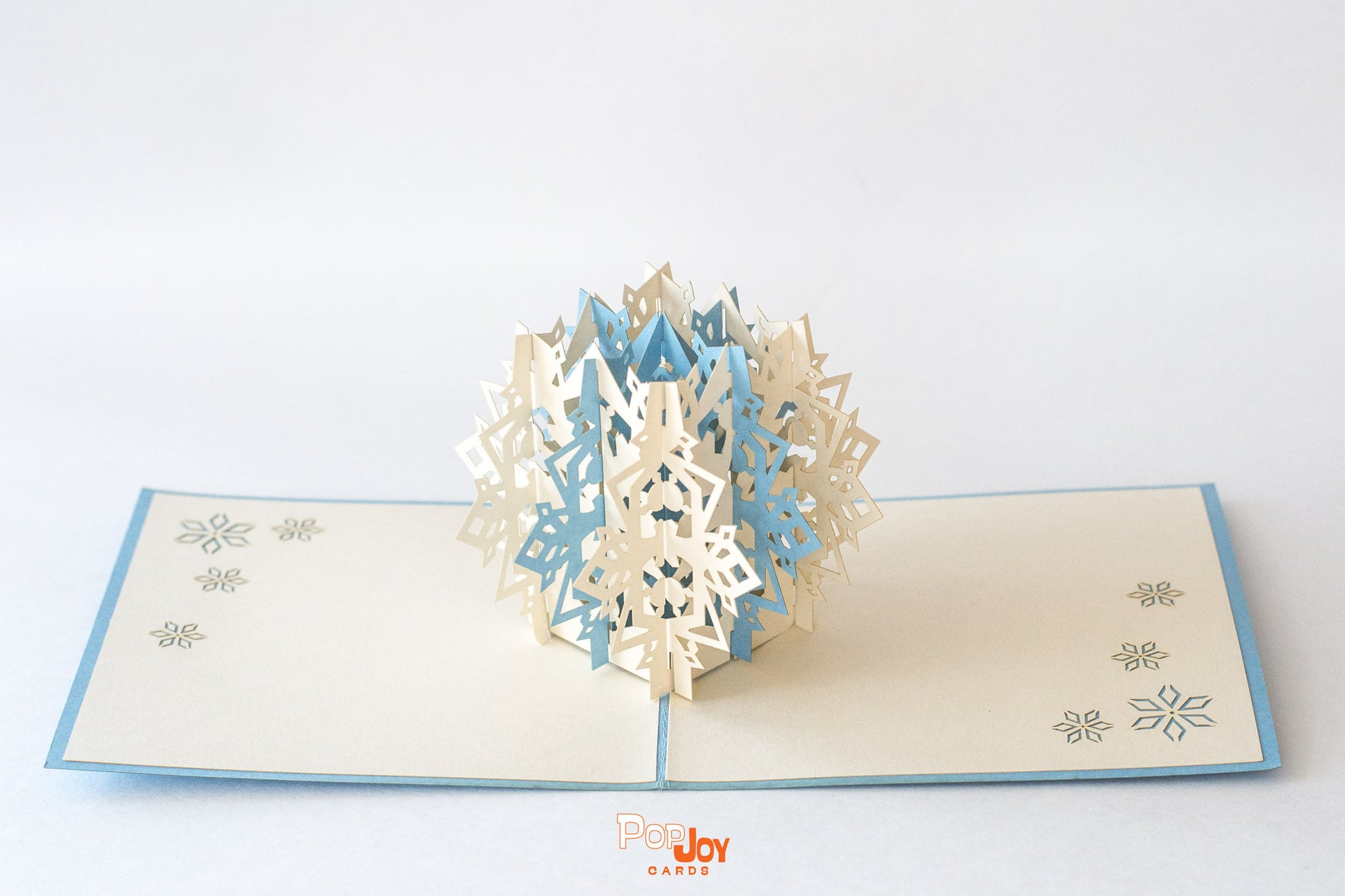 Pop-up card with intricate blue and white snowflake